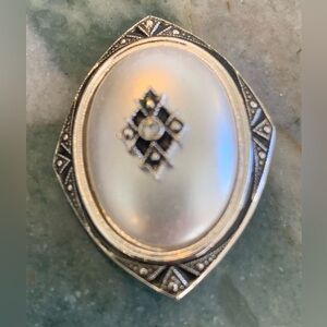 Vintage Elegant Silver tone convertible Brooch adorned with Crystals.